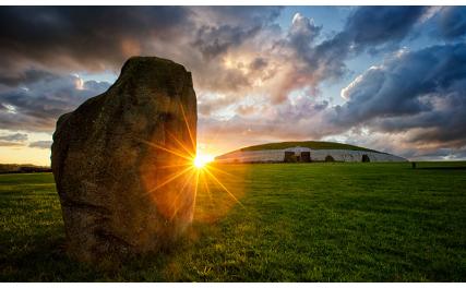 Stone outside Newgrange and sunset
